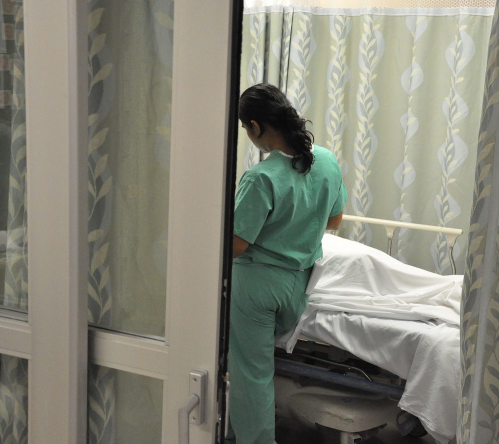 A doctor talking with a patient during a consultation